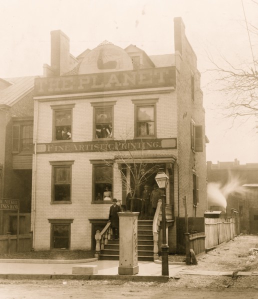 People posed on porch of and in the Planet newspaper publishing house, Richmond, Virginia 1900