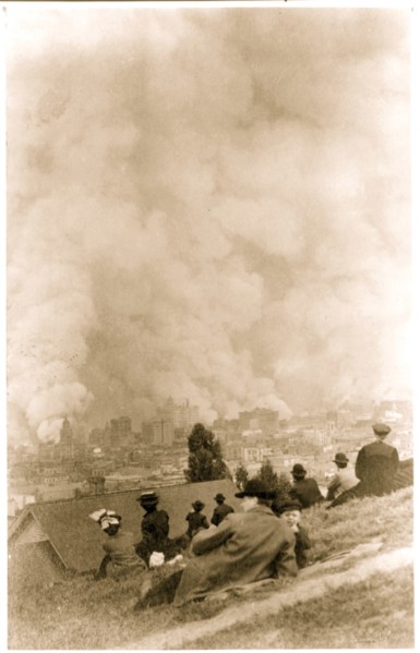 People sit on hill overlooking the Fires after the earthquake 1906