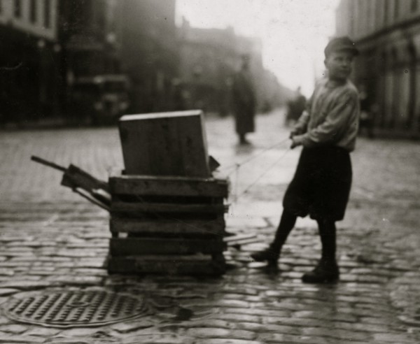 Scavenger Totes Wood and pulls heavy dolly 1916