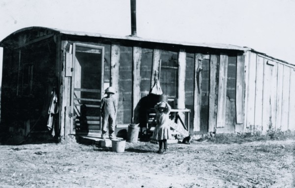 Shack in which the Reibers live, 10 x 15 ft. with a small shed attached 1915