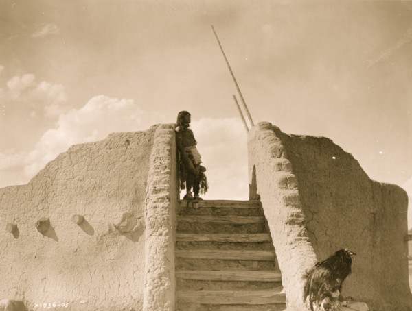 Tewa Indian guard at top of the kiva stairs, San Ildefonso, New Mexico 1905