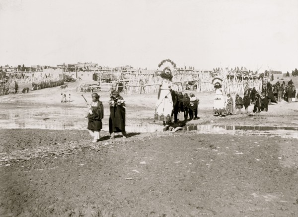 The Shalaco dancers crossing to south side of the river to dance on the plain 1898