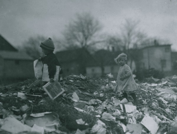 Two children going through the "Dumps." Location 1912
