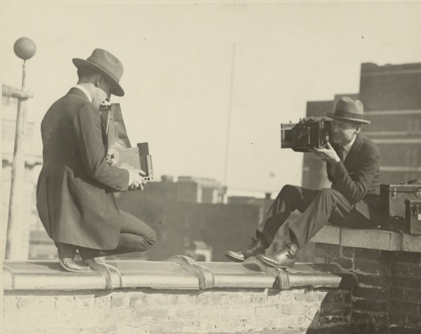 High Up Cameramen Shoot Each other