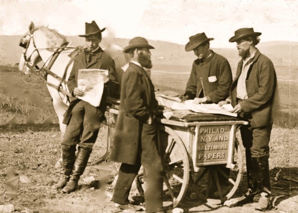 Newspaper vendor and cart in camp 1863