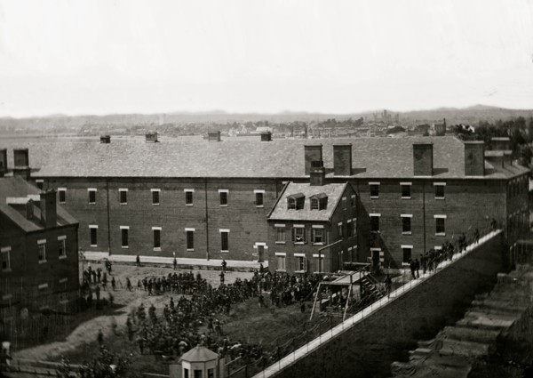 Washington, D.C. Execution of the conspirators: scaffold in use and crowd in the yard, seen from the roof of the Arsenal 1865