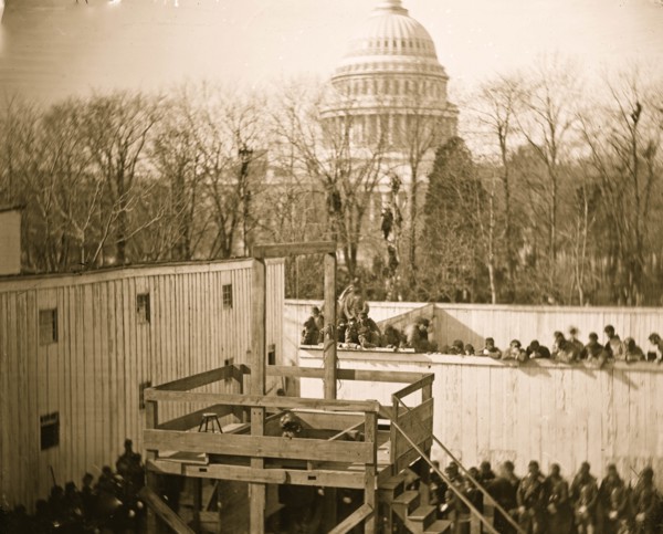 Washington, D.C. Hooded body of Captain Wirz hanging from the scaffold 1865
