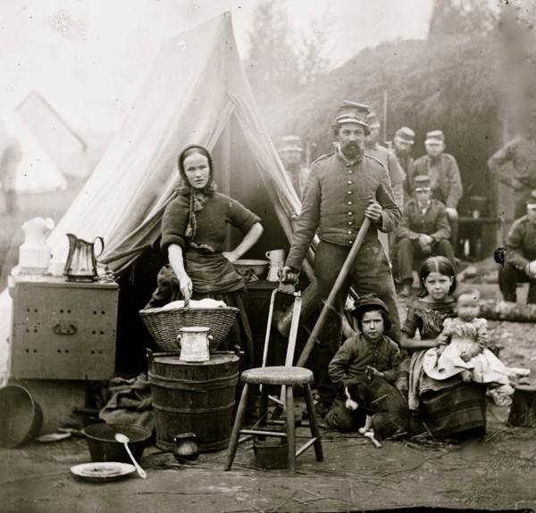 Washington, District of Columbia. Tent life of the 31st Penn. Inf. (later, 82d Penn. Inf.) at Queen's farm, vicinity of Fort Slocum; husband and wife with Children and a baby; wife does wash 1861