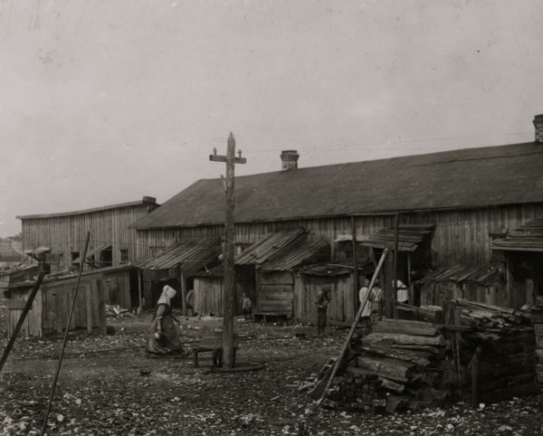 About 50 persons housed in this miserable row of dilapidated shacks located on an old shell-pile and partly surrounded by a tidal marsh.  1912