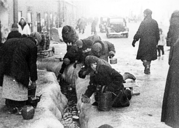 world war ll: the siege of leningrad, women taking water flowing from broken water mains.