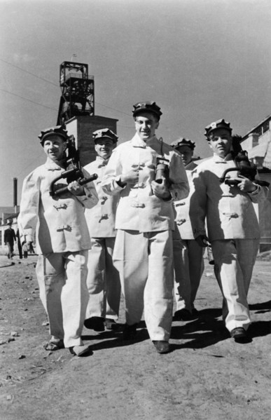 Alexander molodchenko (center) with fellow miners at the kaganovich mines in the krivoi rog fields, ussr, 1949.