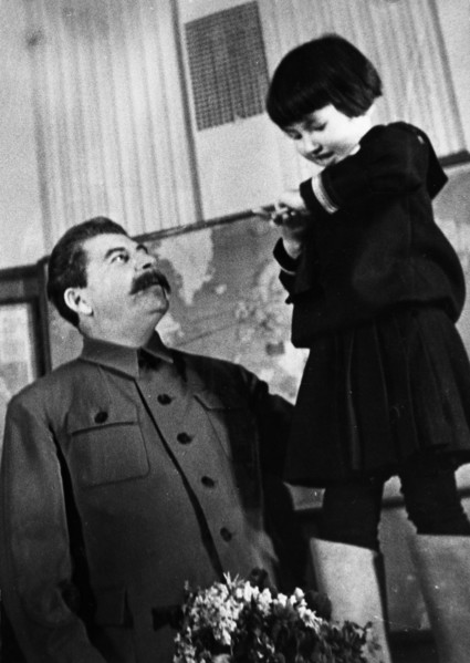 Joseph stalin receiving a bouquet of flowers from engelsina (gelya) markizova, the 7-year-old daughter of the second secretary of the buryat-mongolian regional party committee in 1936, stalin had him ...