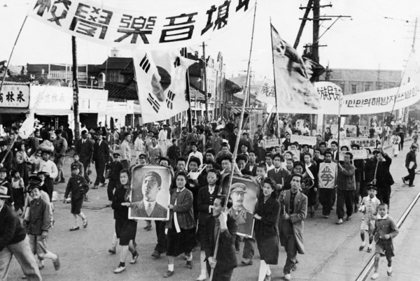 A demonstration in pyongyang, north korea held on the day when the returns of the elections to the people's committees were published, may 1947.