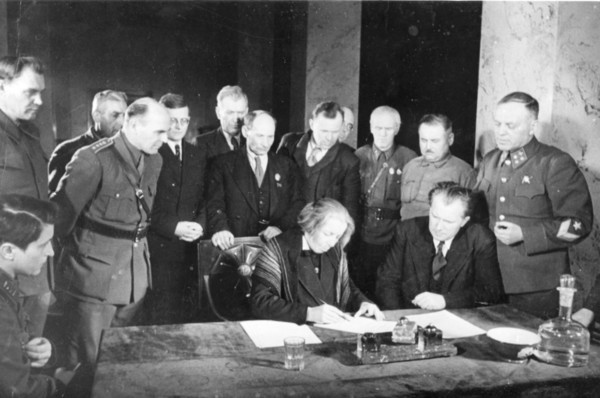 Second all-slav meeting in moscow, signing a message to the slavic peoples: at the table, stelia blagoeva, bulgarian leader (left), also pictured (l, to r,) are polish writer wanda wasilewska, compose...