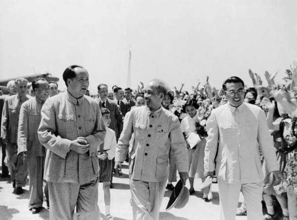 President ho chi minh of the democratic republic of vietnam being met at the airport by chairman mao zedong upon his arrival in peking (beijing), china on june 25, 1955.