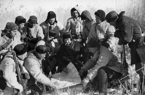 Soviet partisans planning a raid on the germans during world war 2, january 1942.