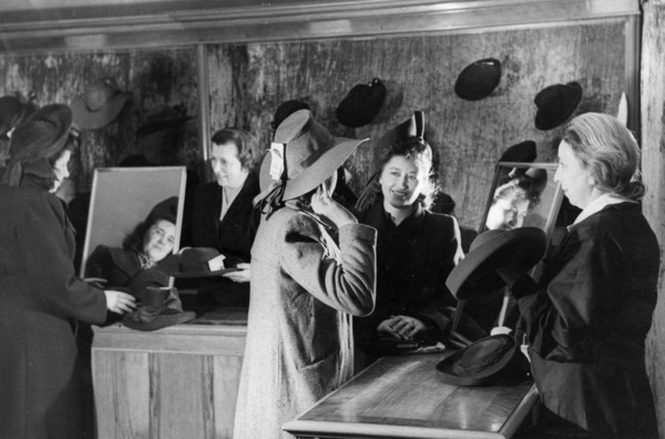 Women trying on hats at a millinery in moscow, april 1948.
