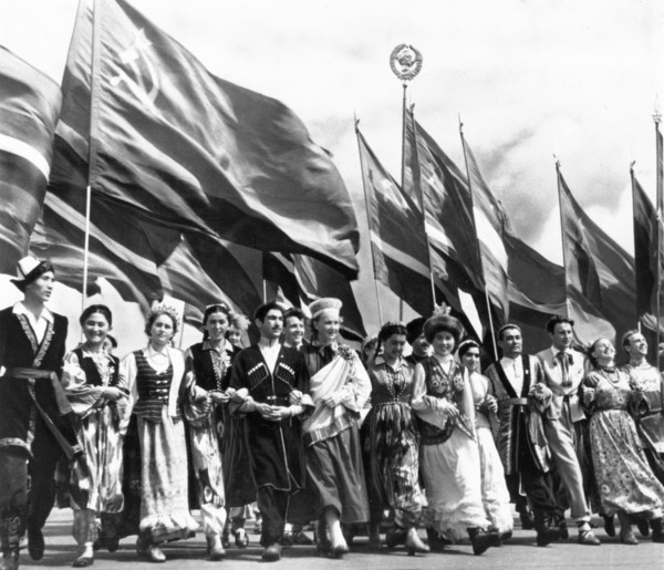 Sixth world festival of youth and students in moscow, july 28, 1957, delegates of the soviet union, representing all 15 republics, marching in lenin stadium during the opening ceremonies.