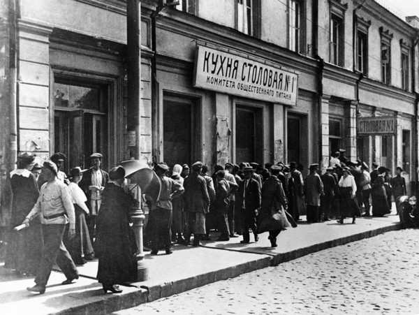Moscow residents lining up at a canteen of the moscow public catering committee in 1921.