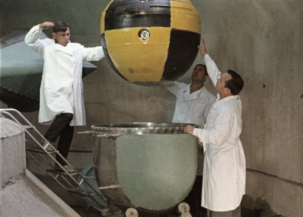 The descent capsule of soviet space probe venera 5 or 6 being lowered into a centrifuge for testing, this is a still from the film 'the storming of venus', produced by e, kuzis at the tsentrnauchfilm ...