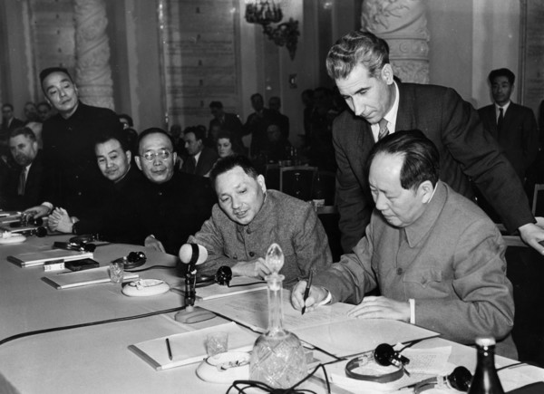 Mao zedong and deng xiaoping during the signing of the declaration with representatives of the communist and workers' parties of the socialist countries, moscow, ussr.