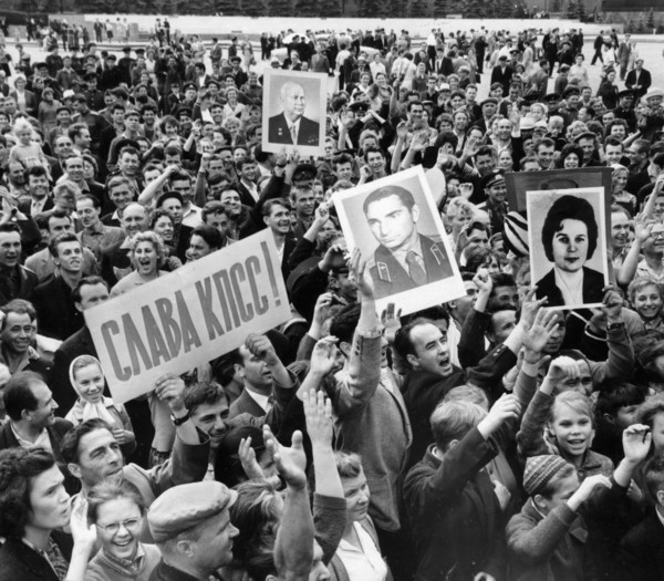 Moscow residents cheering the news of a successful launch of vostok 5 space craft, piloted by soviet woman cosmonaut valentina tereshkova, the picture was taken 5 minutes after the official tass annou...