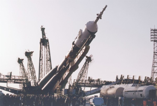 Baikonur, kazakhstan , april 26, 2001, a souyz tm-32 spacecraft with a booster-rocket pictured being erected at a launching site of baikonur cosmodrome on thursday , the launch of a russian crew and t...