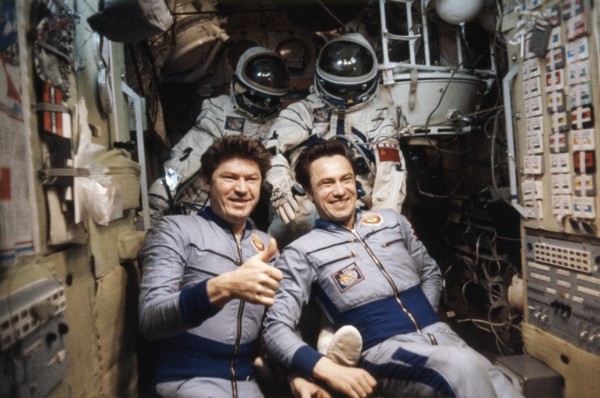 Soviet cosmonauts valery ryumin (left) and leonid popov, crew of the soyuz 35 mission, aboard the salyut 6 space station, april 1980.