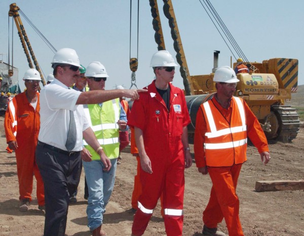 Azerbaijan, august 11, 2003, head of azerbaijan government ilkham aliyev (l) pictured visiting the construction site of the baku-ceyhan oil pipe line,on monday.