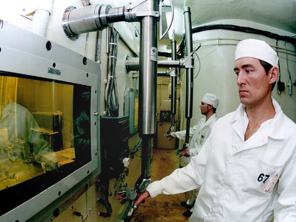 Ulyanovsk region, russia, december 2 2002: operator alexander glotov, of the all-russian institute of atomic reactors (nllar), controls a chamber for production of springs, filled with cerium-144, the...