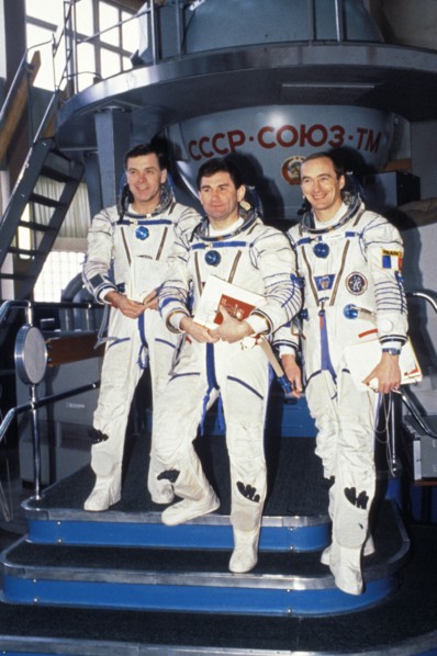 Soyuz tm-17, aleksandr serebrov, vasily tsibliyev, and jean-pierre haignere in front of a soyuz simulator during training, 1993.