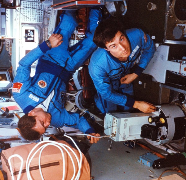 Soyuz tm-7, soviet cosmonauts alexander volkov and sergei krikalev (right) conducting an experiment aboard the mir space station, 1988.
