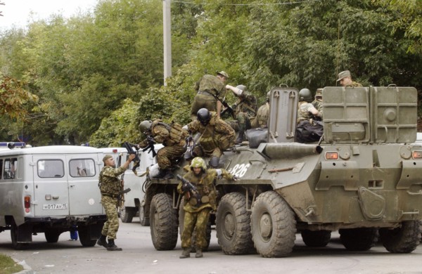 Special forces soldiers take position at a seized school in beslan, north ossetia, friday, sept, 3, 2004.
