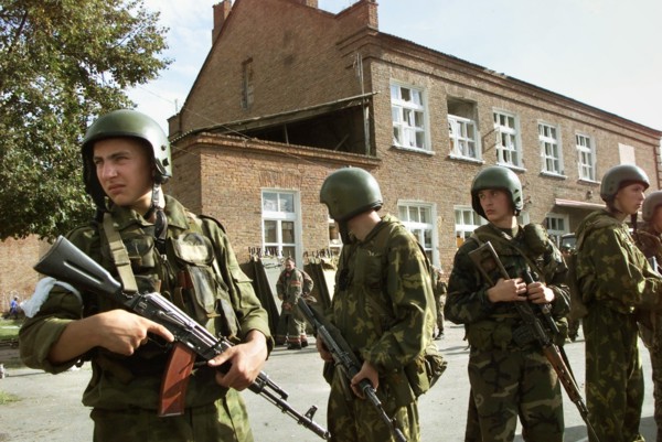 Beslan, north ossetia, russia, september 3, 2004, servicemen with litters prepared for wounded in the yard of the school seized by terrorists.
