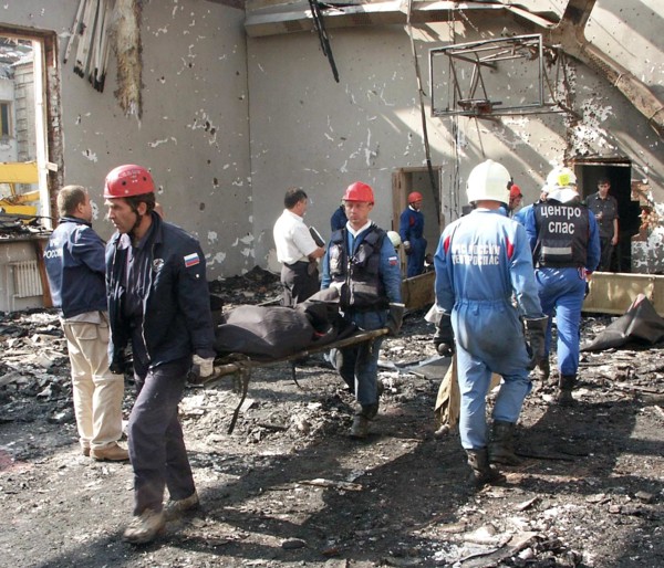 North ossetia, russia, september 4, 2004, russian emergency workers remove victims' bodies from the debris of the school in beslan.