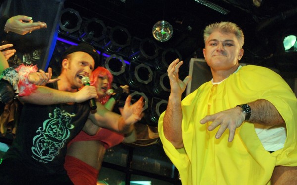 Tv presenter, athlete vladimir turchinsky (r) marks his birthday in the slava night entertainment center, december 5, 2005.