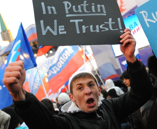 Moscow, russia, december 12, 2011, a young demonstrator holds up a sign reading in putin we trust during a rally staged by pro-kremlin youth groups in central moscow, the event took place two days aft...