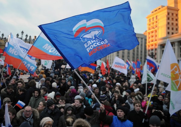 Moscow, russia, december 12, 2011, demonstrators wave flags during a rally staged by pro-kremlin youth groups in central moscow, the event took place two days after a mass protest against alleged vote...