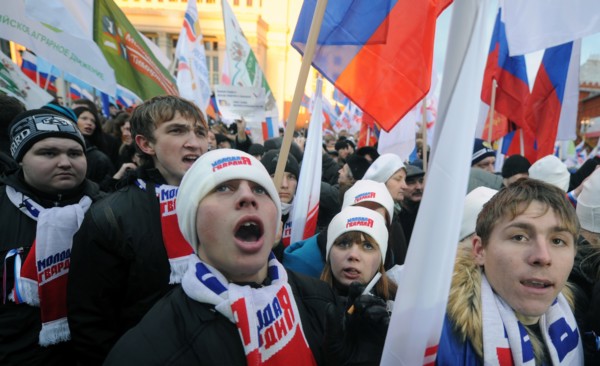 Moscow, russia, december 12, 2011, young demonstrators chant slogans during a rally staged by pro-kremlin youth groups in central moscow, the event took place two days after a mass protest against all...