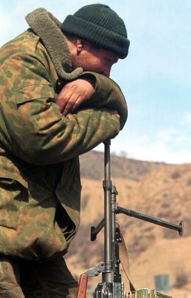 Russian serviceman pictured having a rest after a hard 4-day march his paratroop regiment made from the dzheirakh gorge in ingush republic to the argun gorge in chechnya along a new road to the mounta...