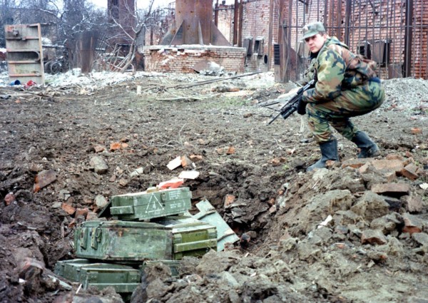 A russian sapper prepares to destroy mines and shells found at house wreckages in the chechen capital of grozny, during the last 24 hours about 2,000 mines and fougasses have been found and defused in...