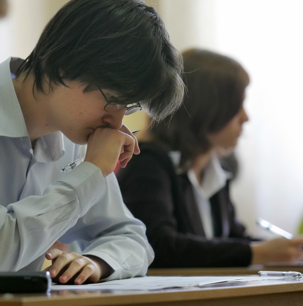 Moscow high school students take the single state exam in social studies, moscow, russia, may 23, 2006.