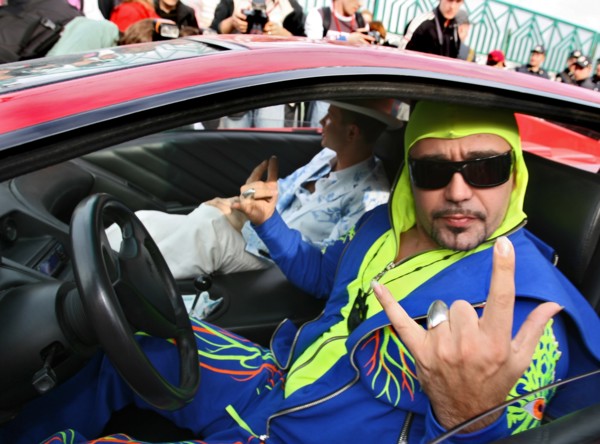 Bogdan titomir, dubbed 'the first russian rapper', gives the heavy-metal sign for victory as he sits in his car near the olympic sports complex, the venue of the 2006 muz-tv awards, prior to the cerem...