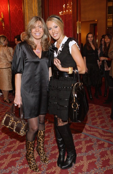 Valentin yudashkin's wife marina (l) and tv host kseniya sobchak pose for a photographer at the party at the metropol hotel after the valentin yudashkin's show at the state kremlin palace, march 9, 20...
