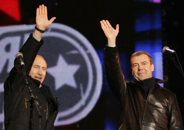Moscow, russia, march 2, 2008, outgoing president vladimir putin (l) and first deputy prime minister dmitry medvedev wave to the audience during a concert in vasilyevsky spusk off red square, marking ...