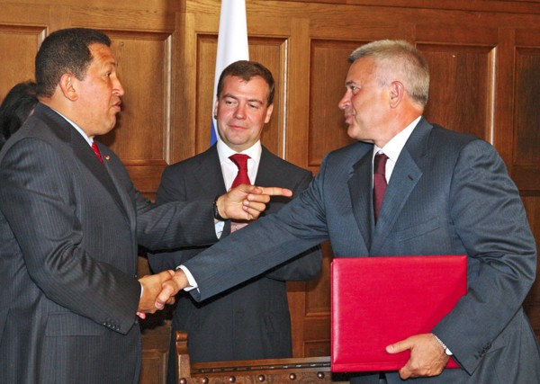 Moscow region, russia, july 22, russian president dmitry medvedev (c) looks on as venezuela's president hugo chavez (l) shakes hands with vagit alekperov, president of lukoil, russian oil company, at ...