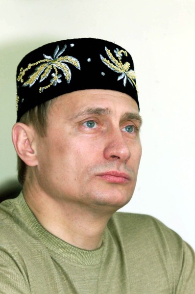 Kazan, tatarstan, russia, june 24 2000, russian president vladimir putin wearing a tatar embroidered skull-cap on his head seen attending an open-air holiday events organized outside kazan, sabantui h...