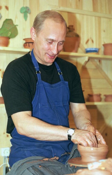 Karelia, russia, august 21 2001, president vladimir putin tries his hand at pottery while visiting the ethnographic village of verkhniye mondrogi on his way to the kizhi island,    21,08,2001 .