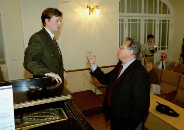 Famous russian opera singer vladimir atlantov (right) teaching danlll sokolov, third year student at the st, petersburg conservatory, st,petersburg, russia, september 12 2002.