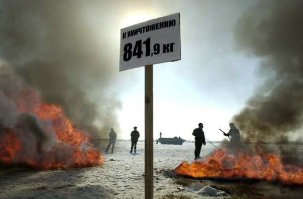 Tajikistan, december 6 2002: men of the moskovsky border detachment burning up packets containing the confiscated drugs with a total weight of 841,9 kilograms, on friday, the drugs were confiscated in...